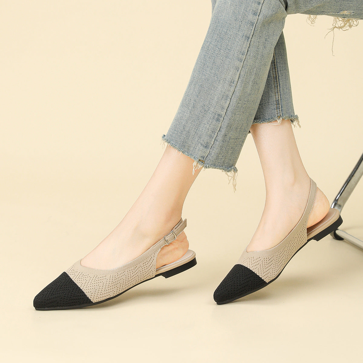 Two-tone beige and black pointed-toe slingback sandals with low thick heel