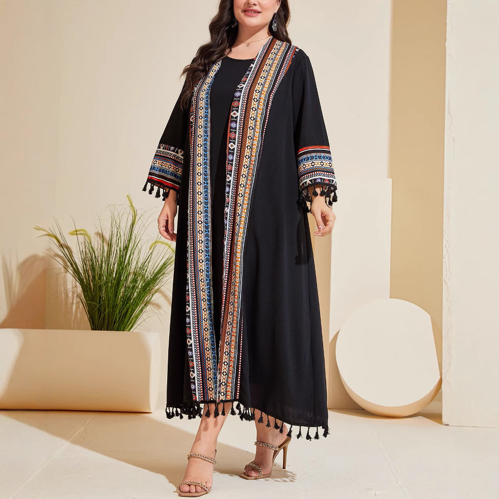 Black long cardigan with colorful embroidered vertical banding and tassel fringe hem
