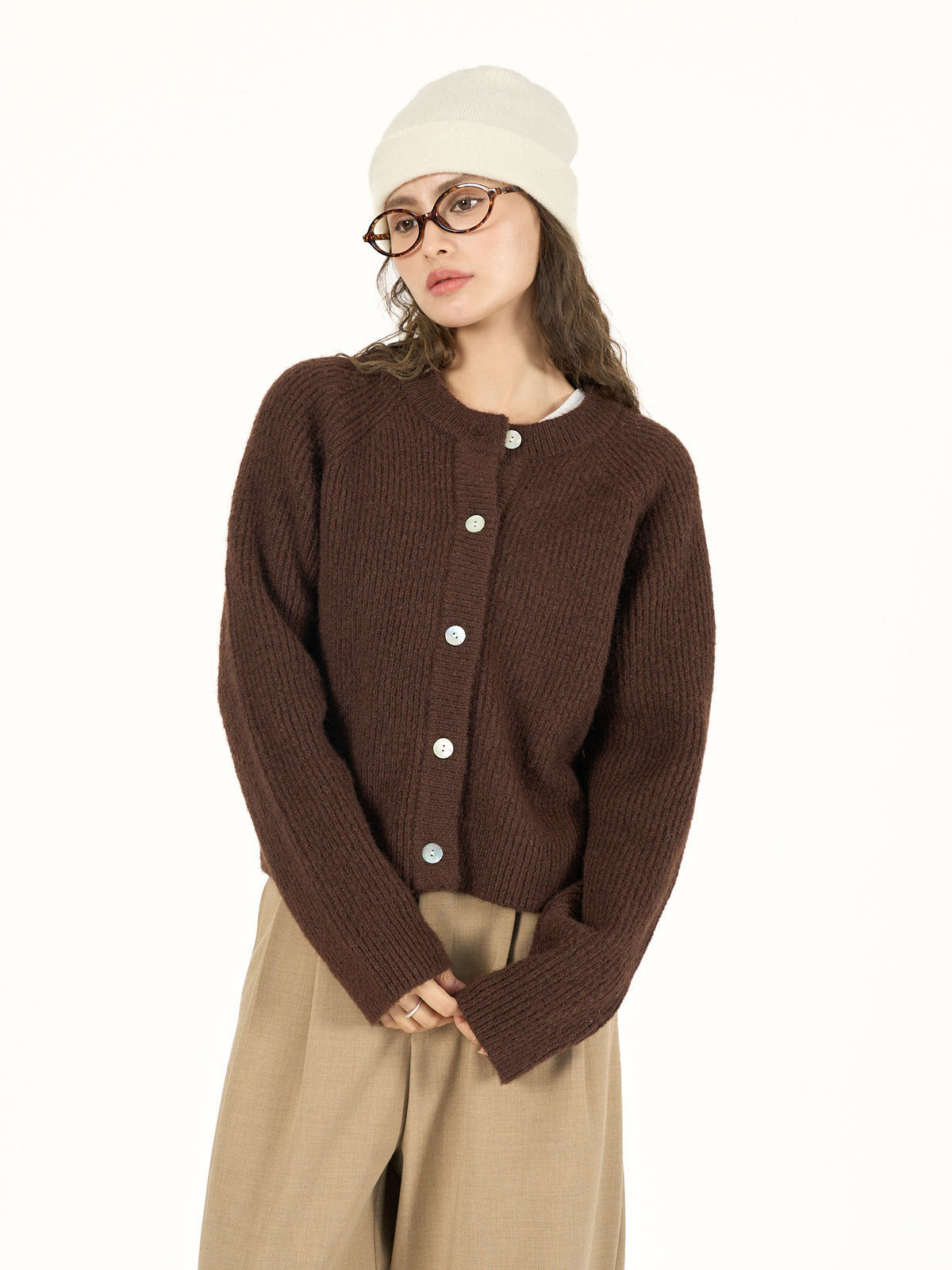 Brown women's knitted cardigan with round neck, long sleeves and button front