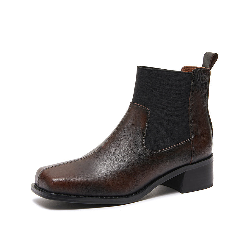 Women’s dark brown leather Chelsea ankle boots with black elastic side panels and block heel