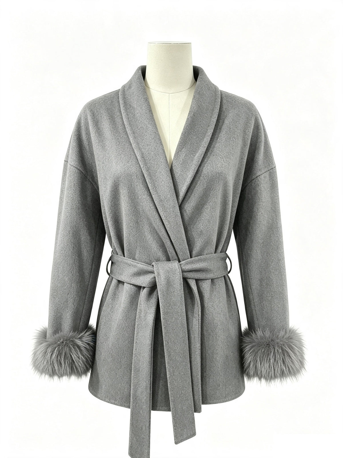 Gray wool wrap coat on mannequin with tie belt, turn-down collar, and faux fur cuffs.