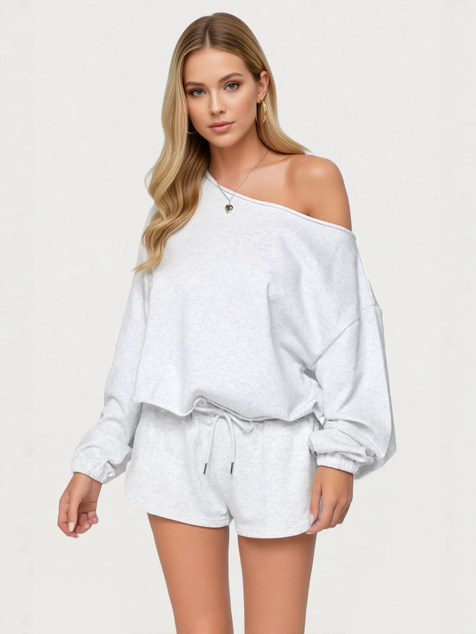 Light gray off-shoulder hoodie with front pocket and matching drawstring shorts
