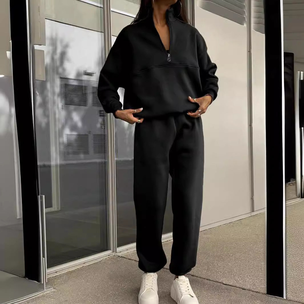 Black zip-lapel two-piece tracksuit set with quarter-zip pullover and cuffed jogger pants