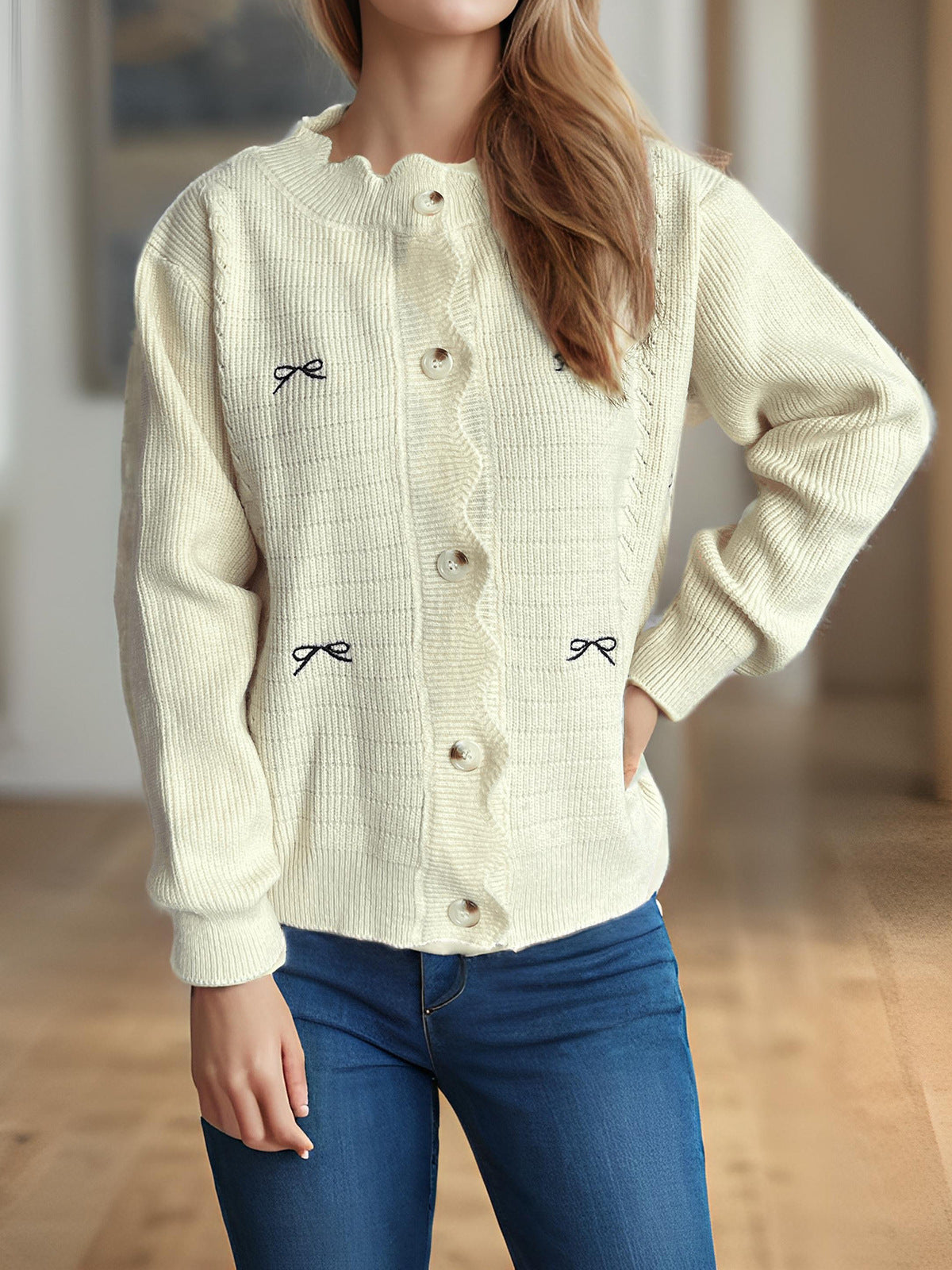 Off-white knit cardigan with bow embroidery, button front, ribbed knit details