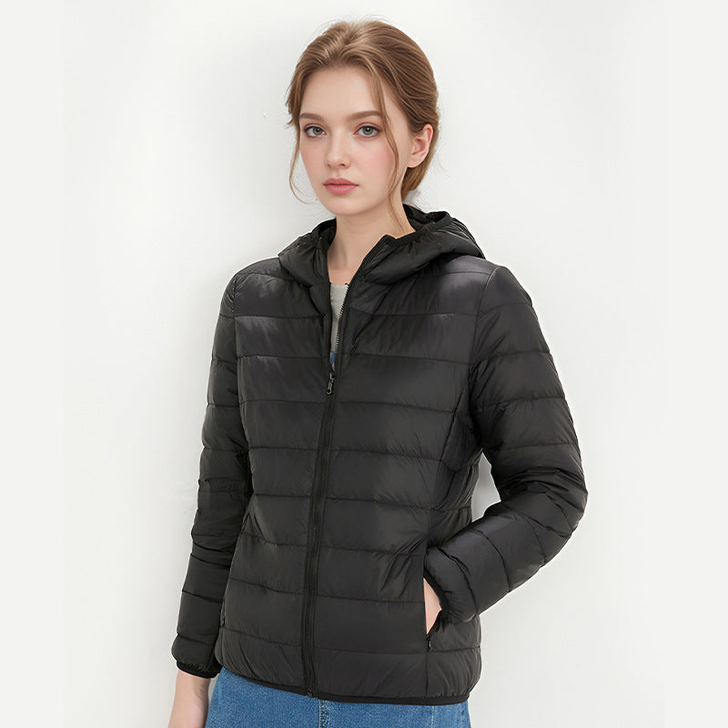 Women's black hooded down jacket with front zipper and side pockets.
