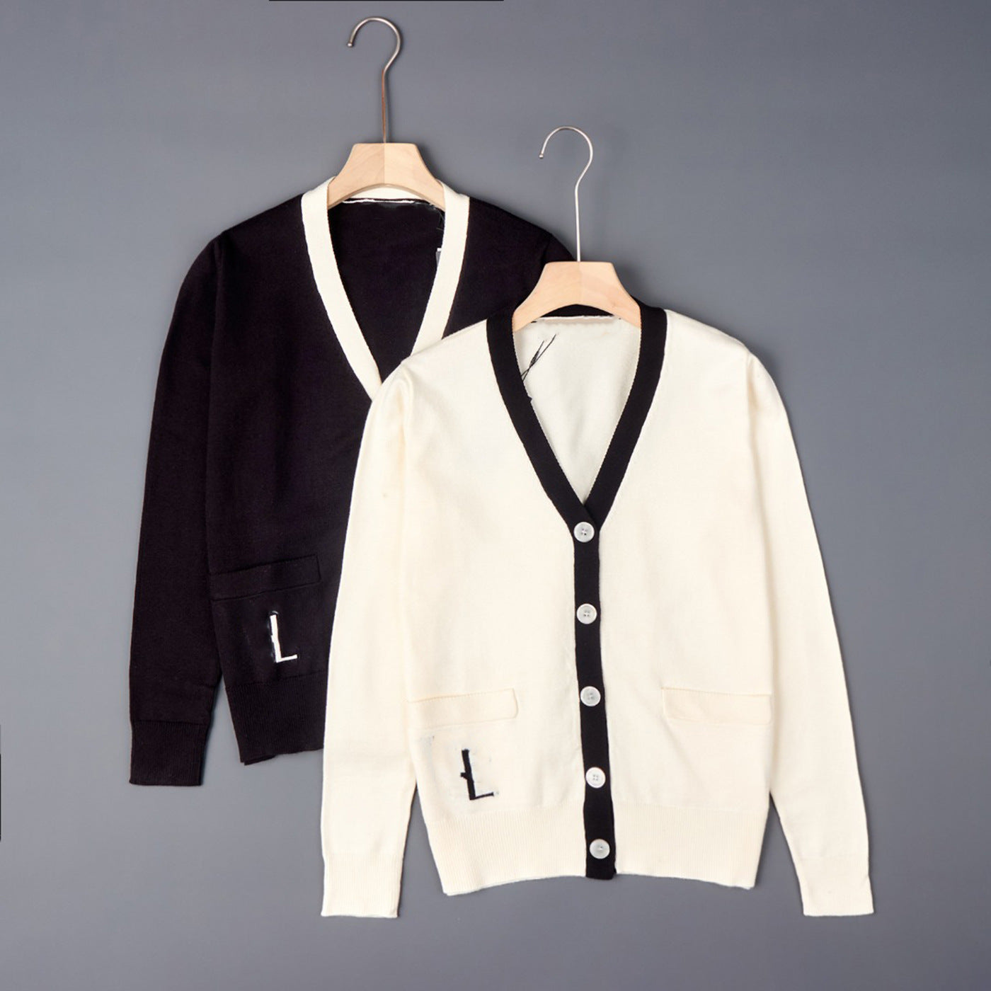 Contrast V-neck button cardigan set on hangers: dark knit with off-white trim