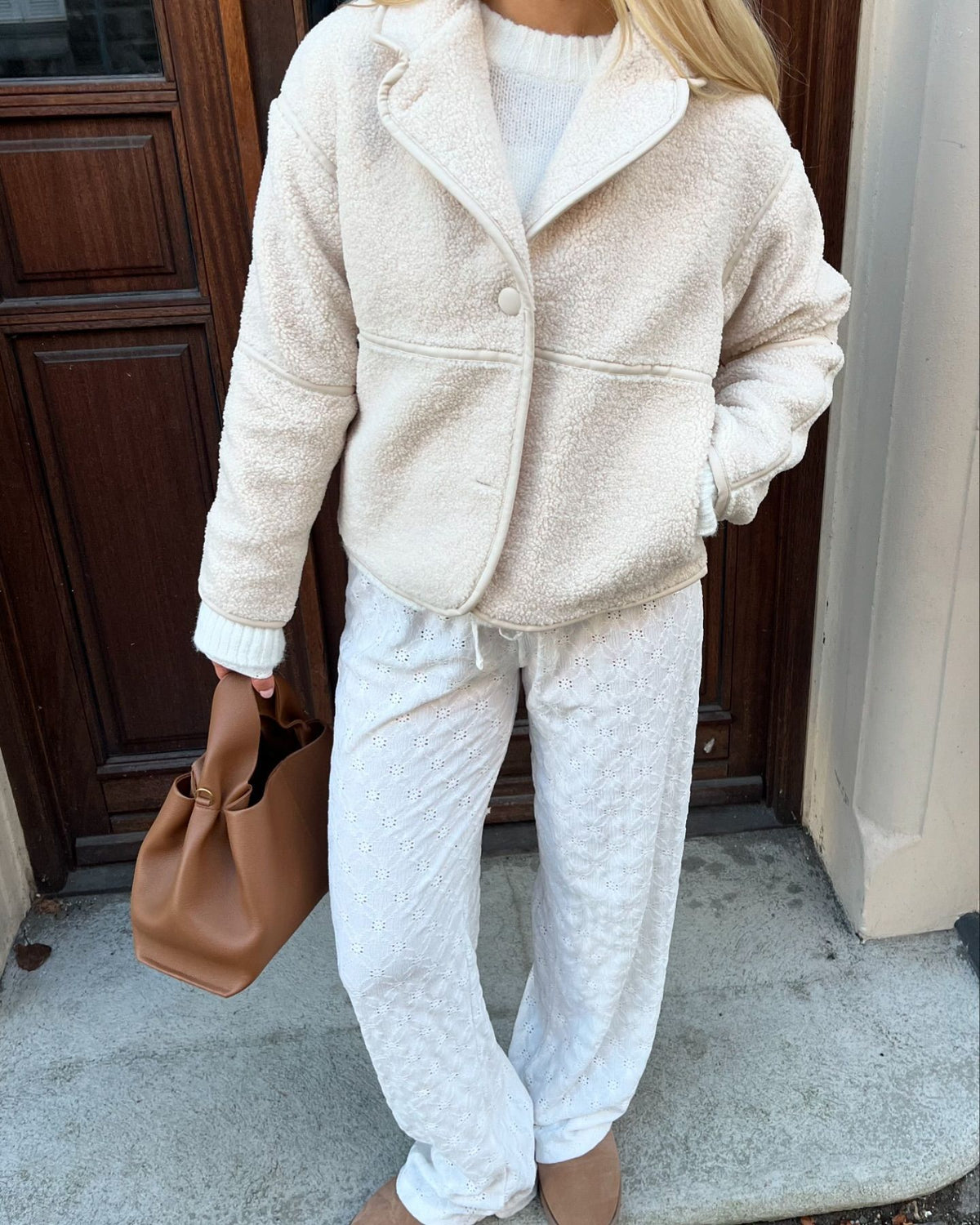 Ivory fleece cardigan jacket with a lapel collar and single button, shown with matching outfit