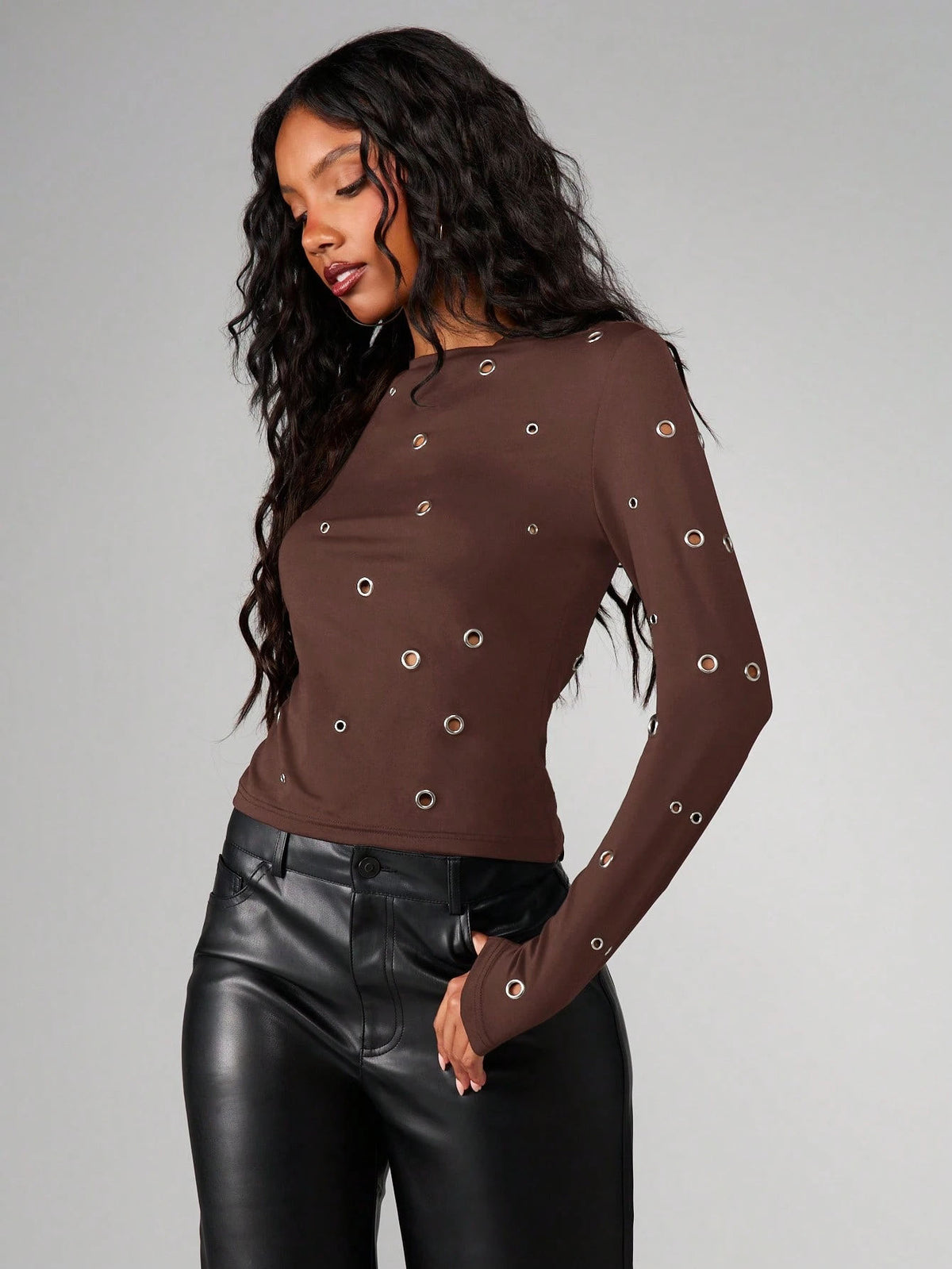 Women’s brown long-sleeve round-neck top with metal eyelet grommet accents