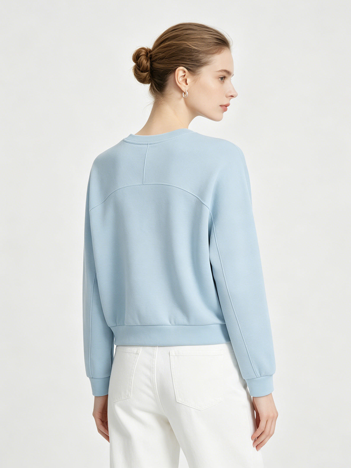 Women's light-blue raglan sweatshirt with crew neck, long sleeves, ribbed hem and cuffs