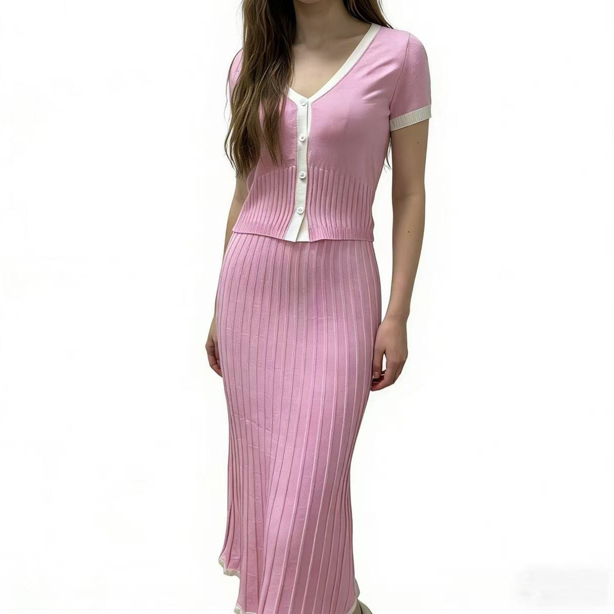 Pink knit two-piece set: short-sleeve button-front top and pleated midi skirt