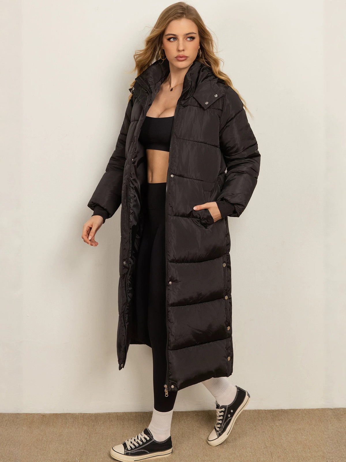 Women's dark charcoal long padded coat with hood, button front and side pockets