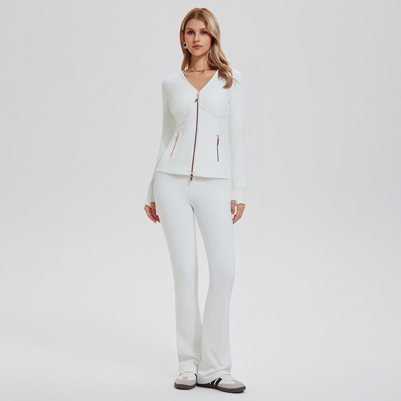 White yoga set with a fitted zip jacket and flared pants