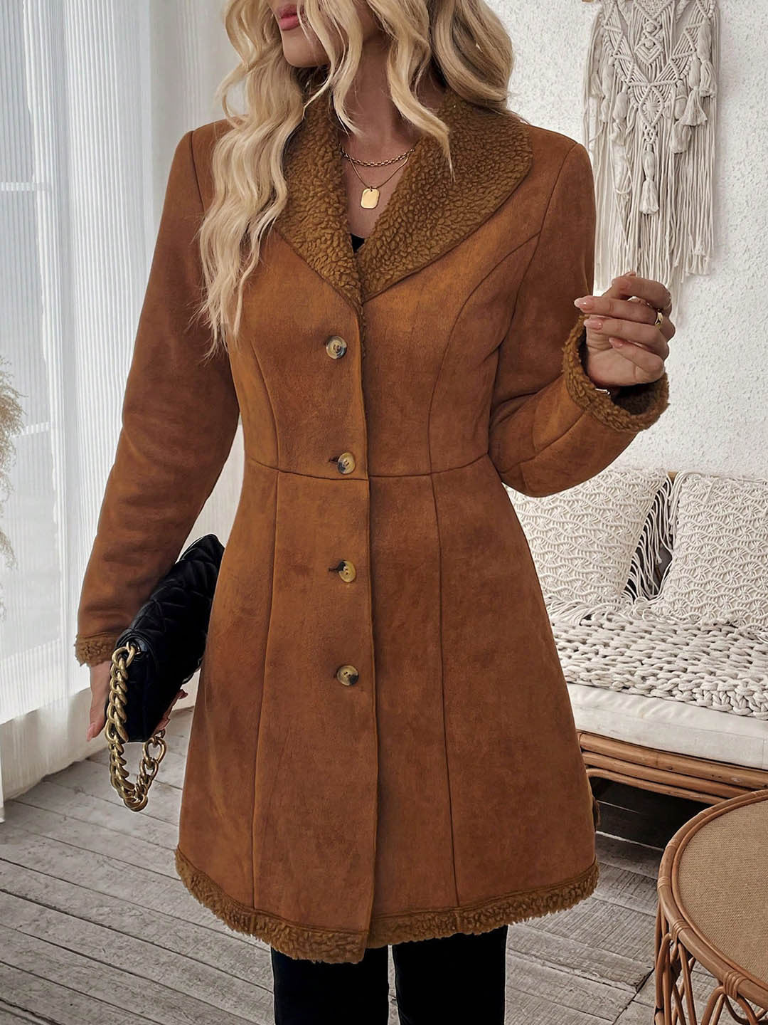 Mid-length brown suede-look jacket with shearling-trim lapel and fitted button front.