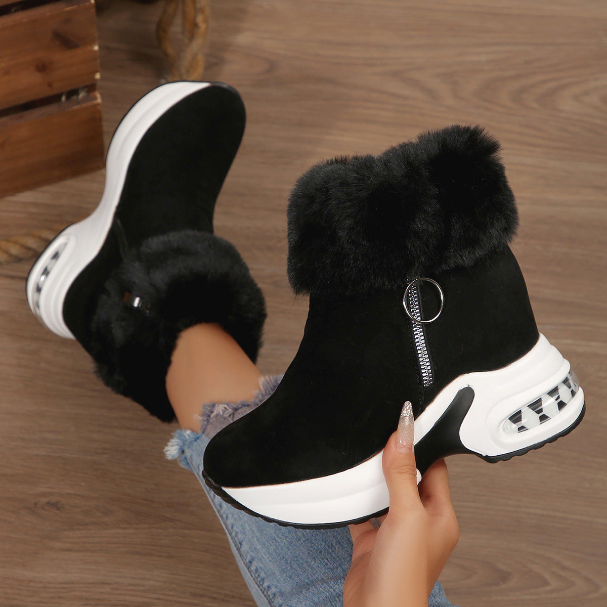 Black fleece-lined snow boots with side zipper, faux-fur cuffs, chunky white platform sole