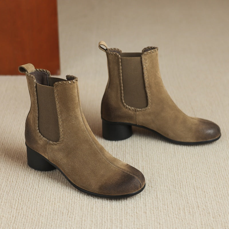 Apricot suede Chelsea ankle boots with round toe and chunky low heel, side by side