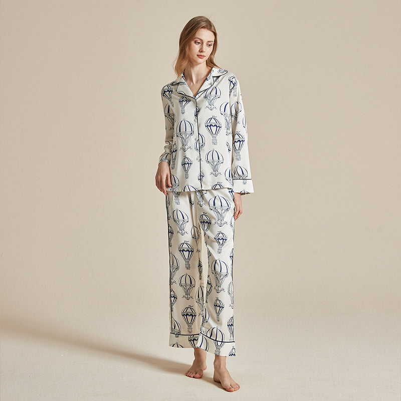 Women’s white printed long-sleeve pajama top and wide-leg trousers set with hot air balloons
