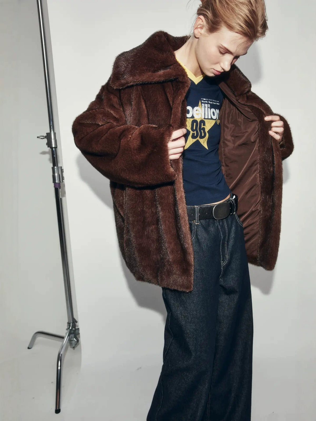 Wine-brown faux fur coat with large lapels and visible button detail