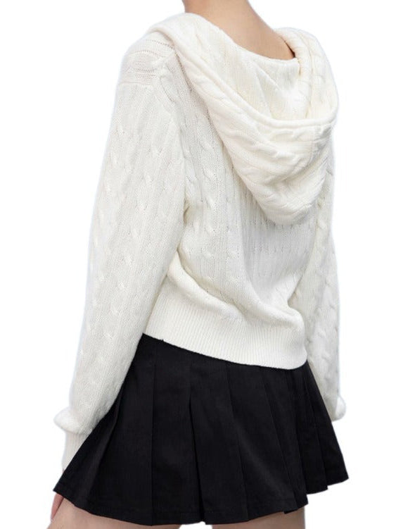 Cream cropped cable-knit zip-up hoodie with hood, front zipper, and ribbed cuffs