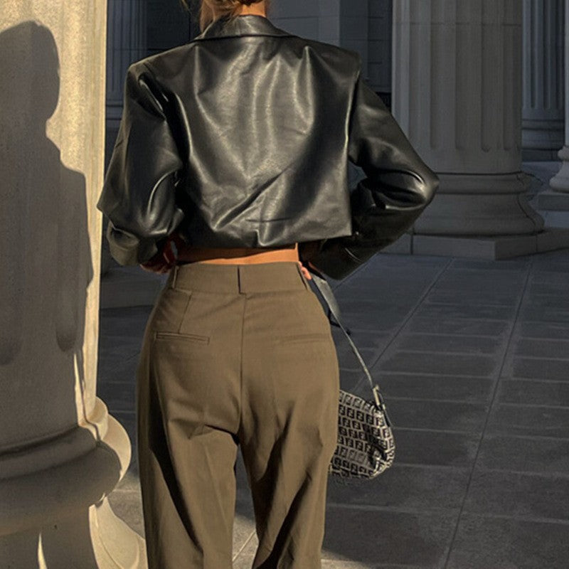 Black cropped biker leather jacket back view with notched collar and shoulder seams