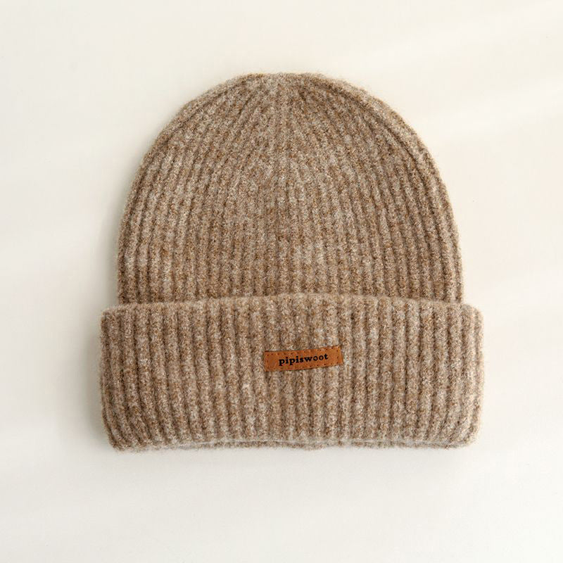 Beige ribbed knit beanie hat with cuff brim and pipiswoot logo patch