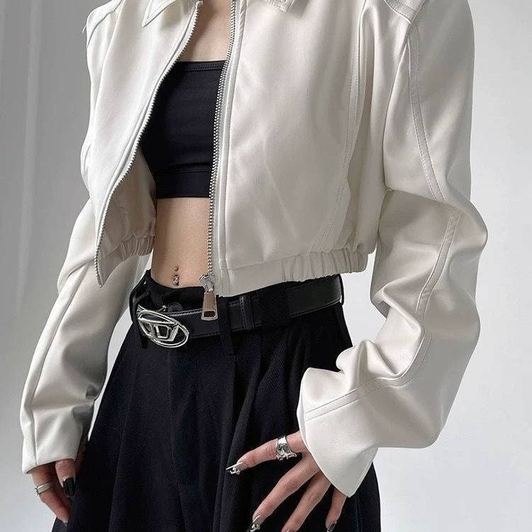 White faux leather cropped jacket with zip front and gathered sleeve cuffs
