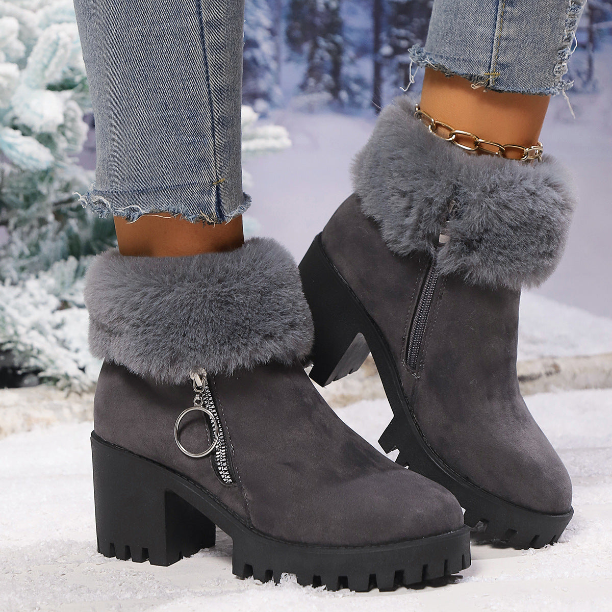 Dark gray suede snow boots with faux fur trim, side zipper, chunky heel, ankle fit.