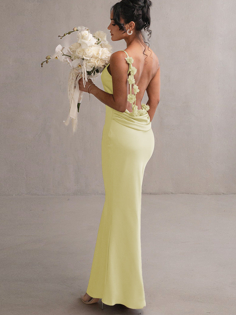 Light yellow backless spaghetti strap maxi dress with floral back detail