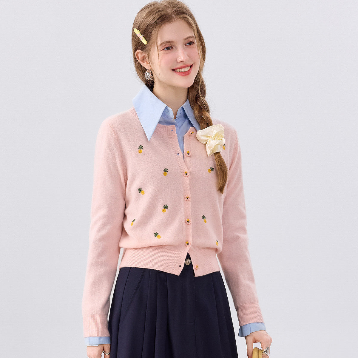 Light pink wool cardigan sweater, round neck, button-front, long sleeves, fruit print
