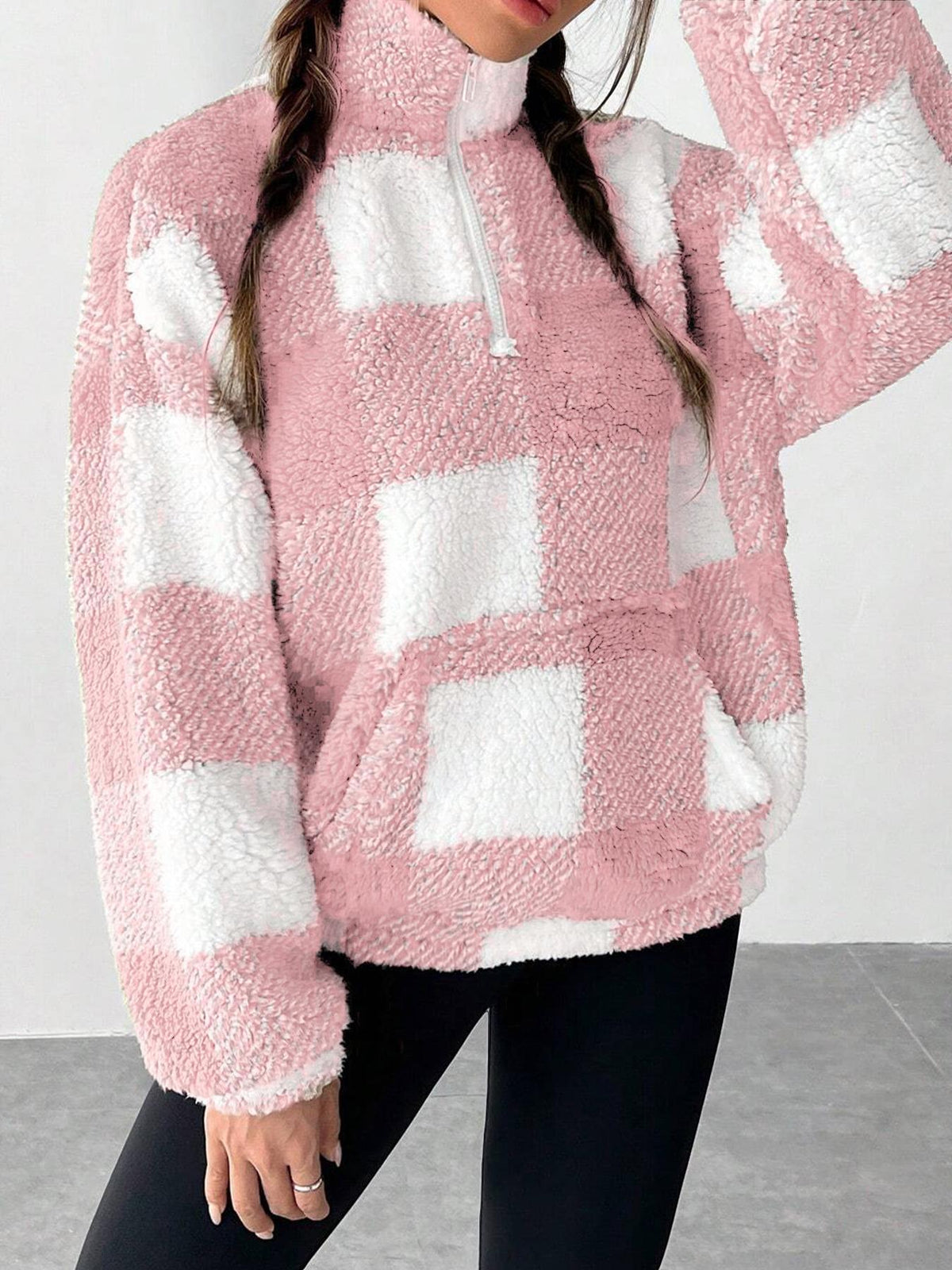 Pink and white plaid fuzzy quarter-zip sweatshirt with half-open collar, relaxed fit