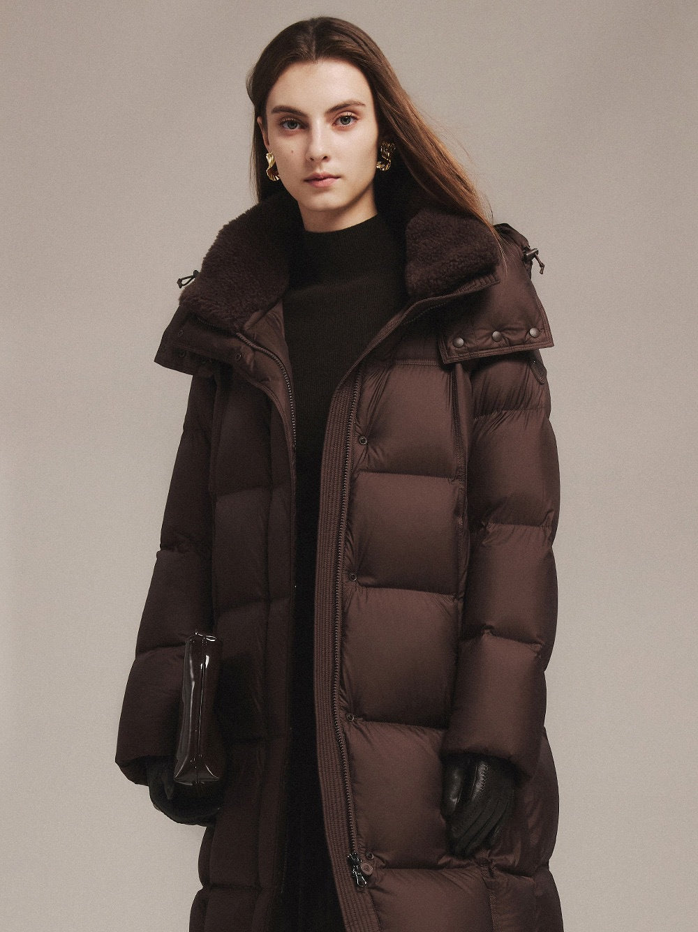 Women's dark brown long down jacket with fur-trimmed collar and zip-front quilted design