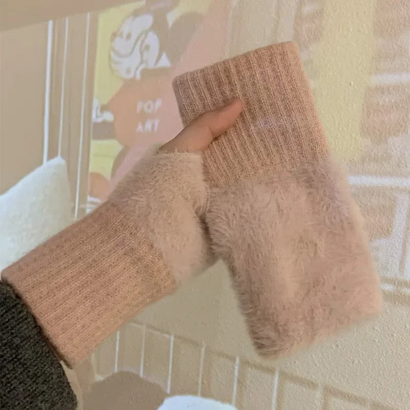 Pink fingerless gloves with plush hand panels and ribbed knit wrists