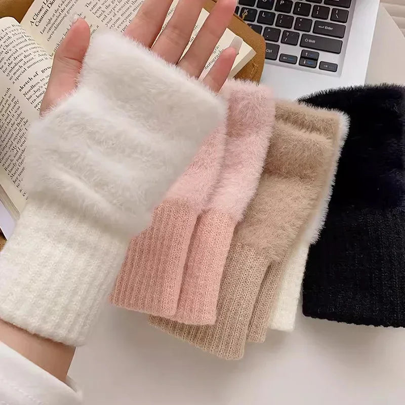 Fingerless gloves in white, pink, beige, and black with plush backs and ribbed cuffs