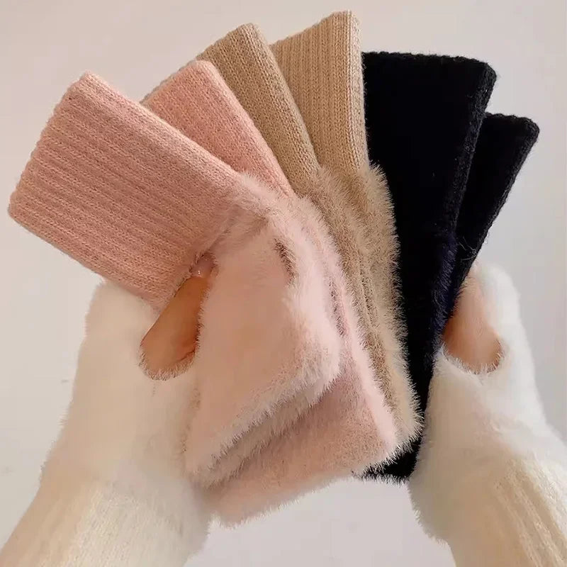Fingerless gloves in pink, beige, black, and white with plush panels and ribbed cuffs
