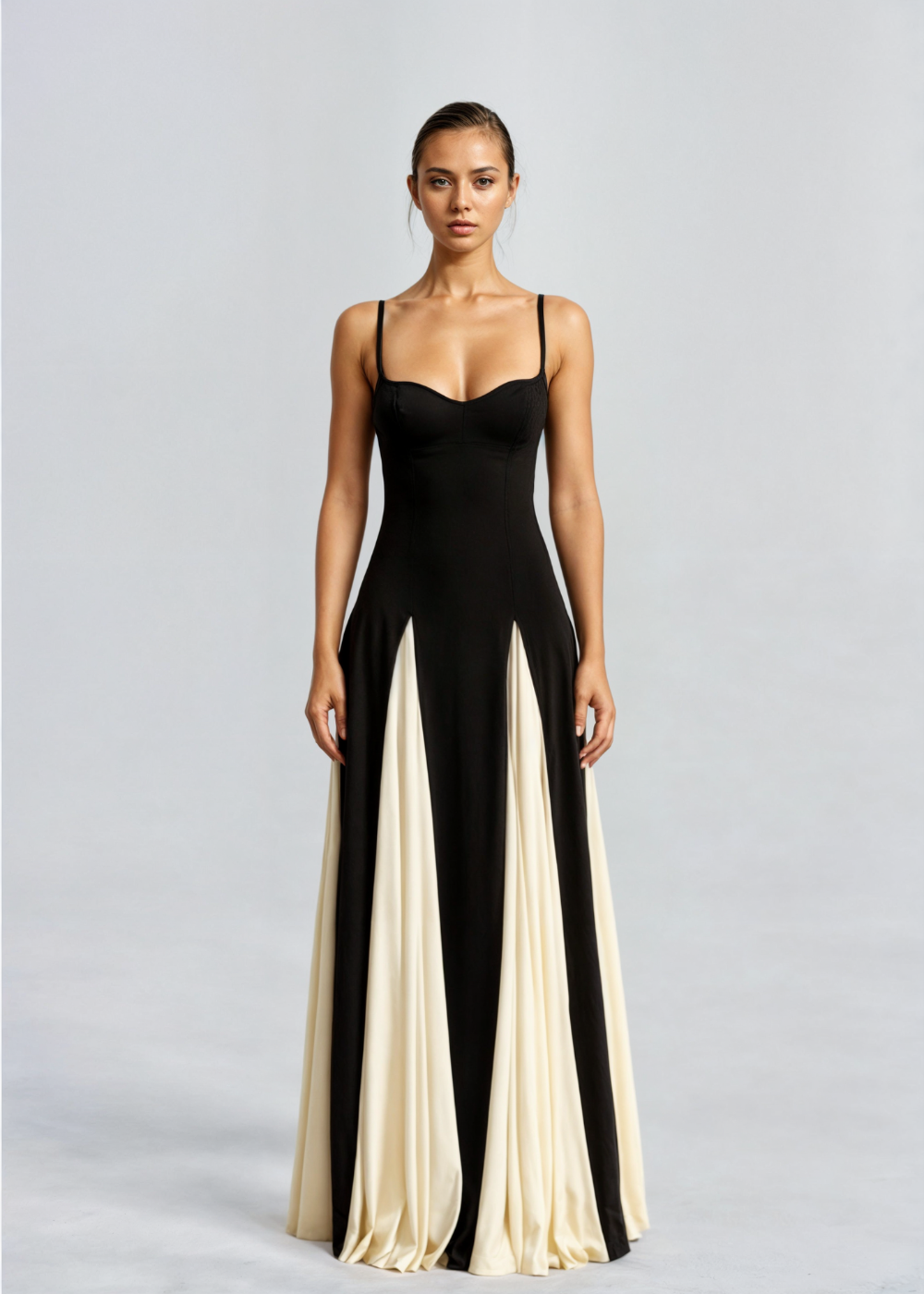 Black satin A-line maxi dress with sweetheart neckline, thin straps, and cream colorblock panels