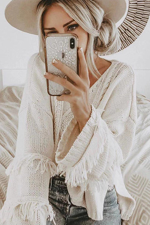 White tassel knit sweater with V-neck and diamond pattern, long fringe cuffs
