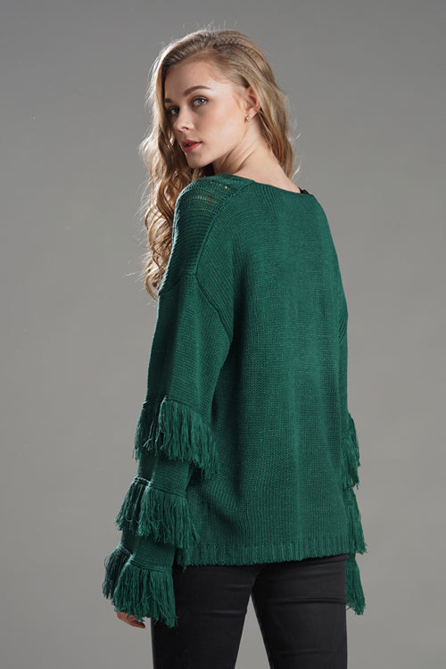 Green tassel knit sweater with fringe trim on three-quarter sleeves, back view