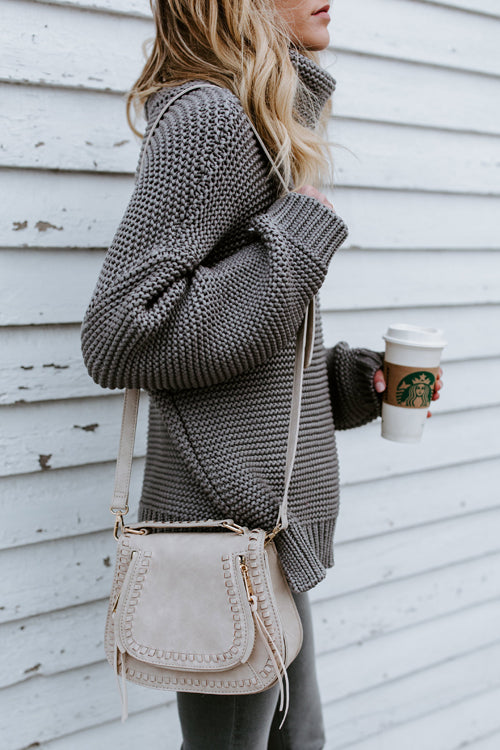 Grey high-neck knit sweater with long sleeves, textured stitch detail