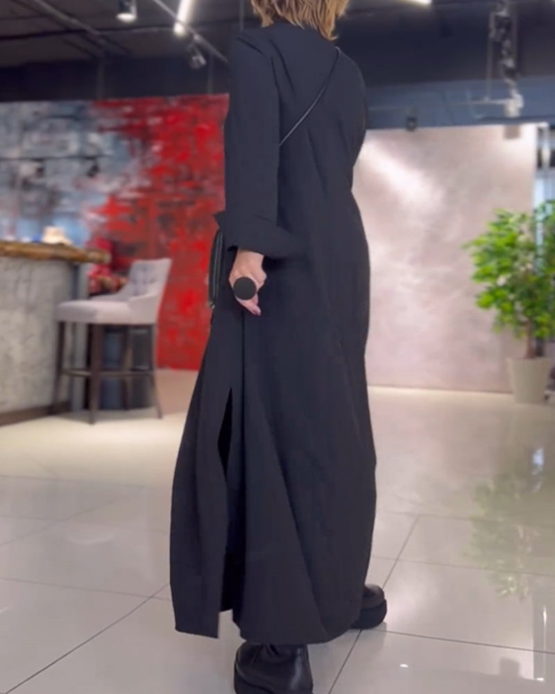 Black long-sleeve maxi dress with stand collar, side pockets, relaxed drape