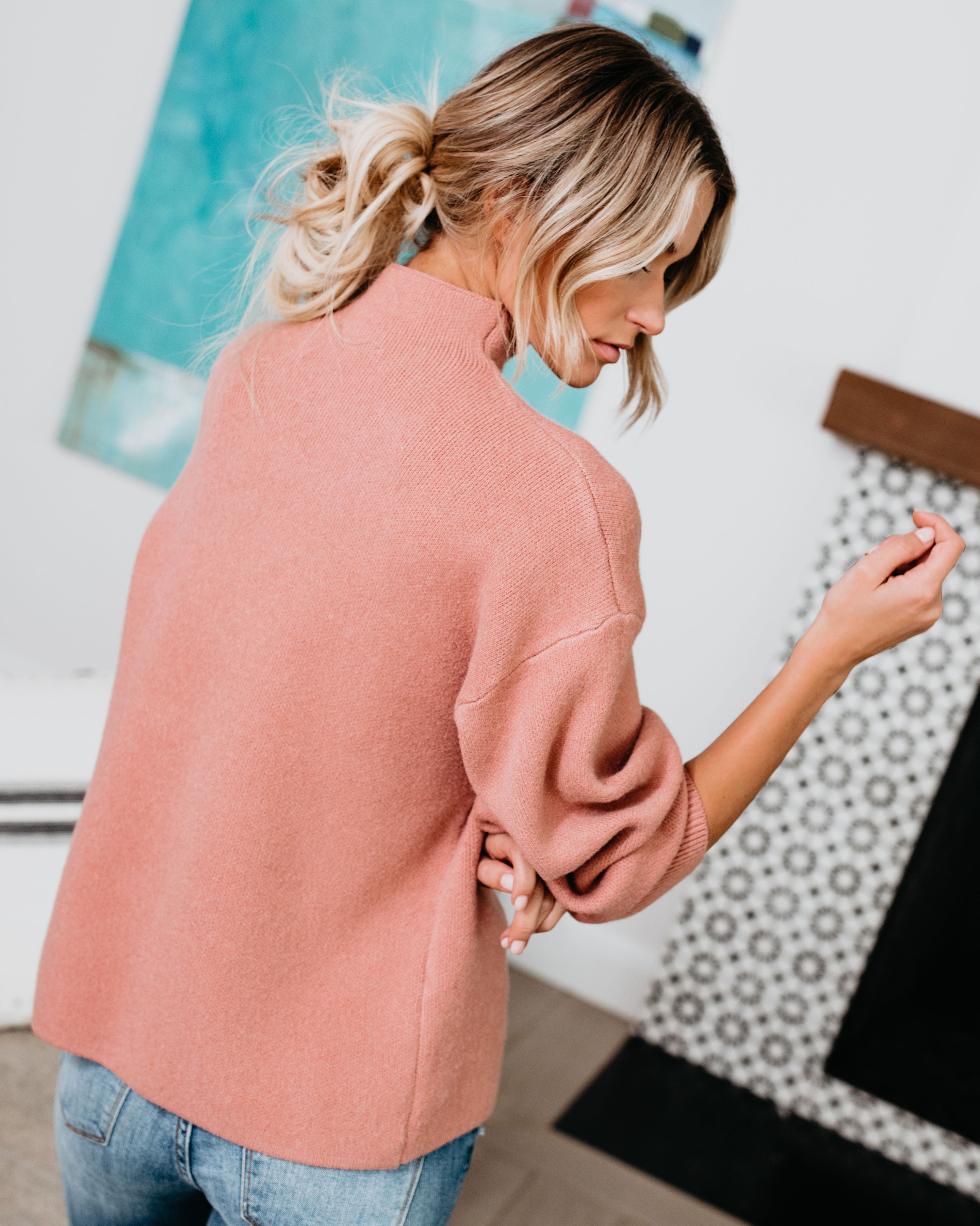 Blush pink mock neck sweater with long sleeves and ribbed collar and cuffs
