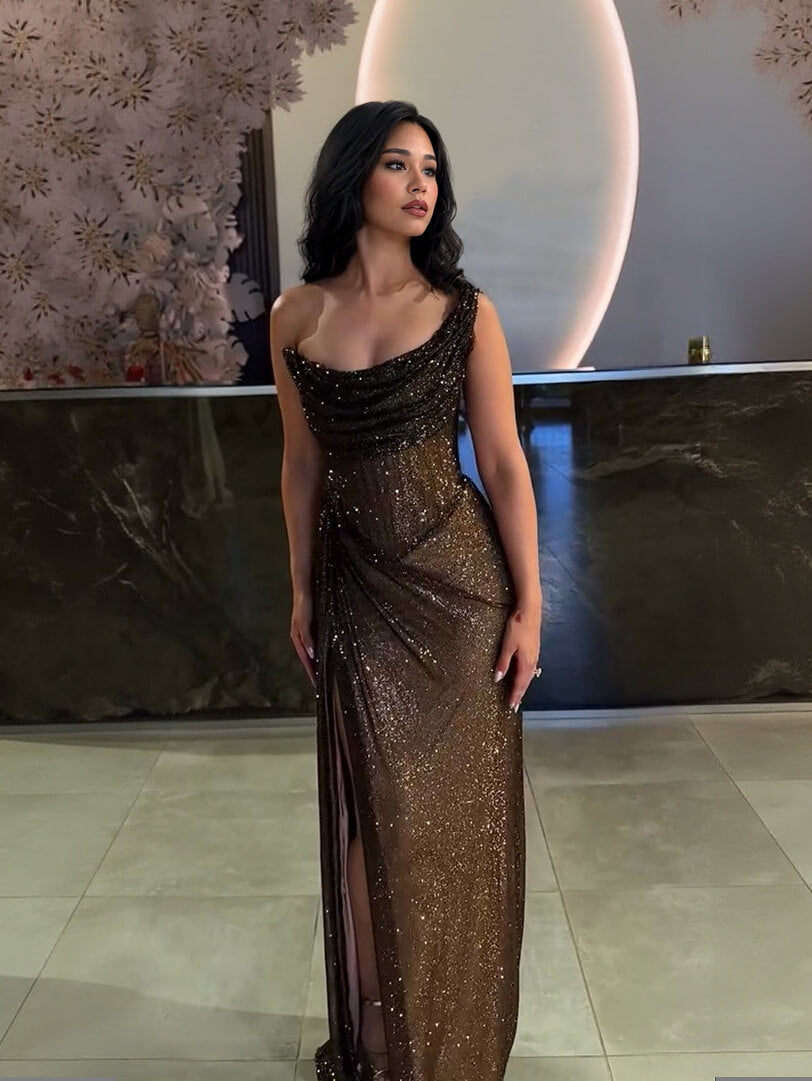 Black sequin bodycon maxi dress with ruched neckline, spaghetti straps, high slit.