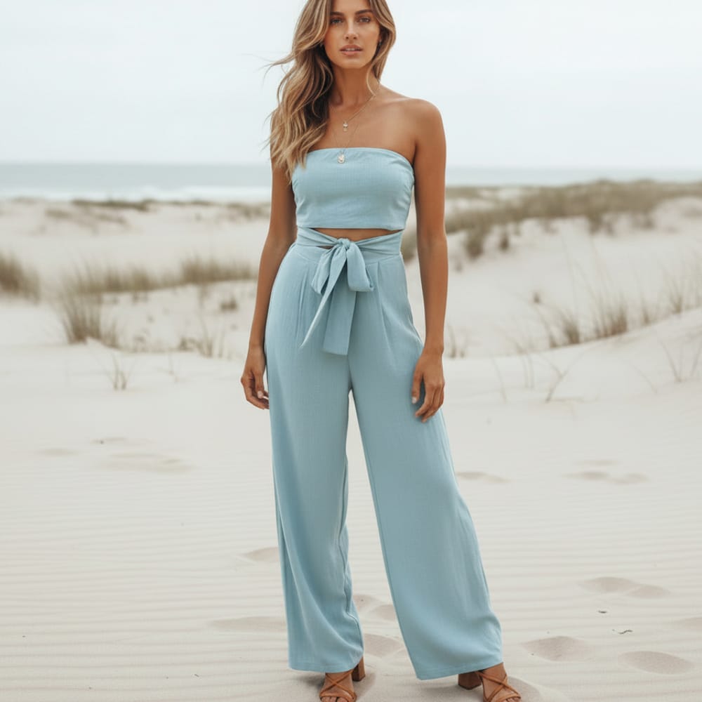 Blue strapless linen jumpsuit with tied waist bow, wide-leg trousers