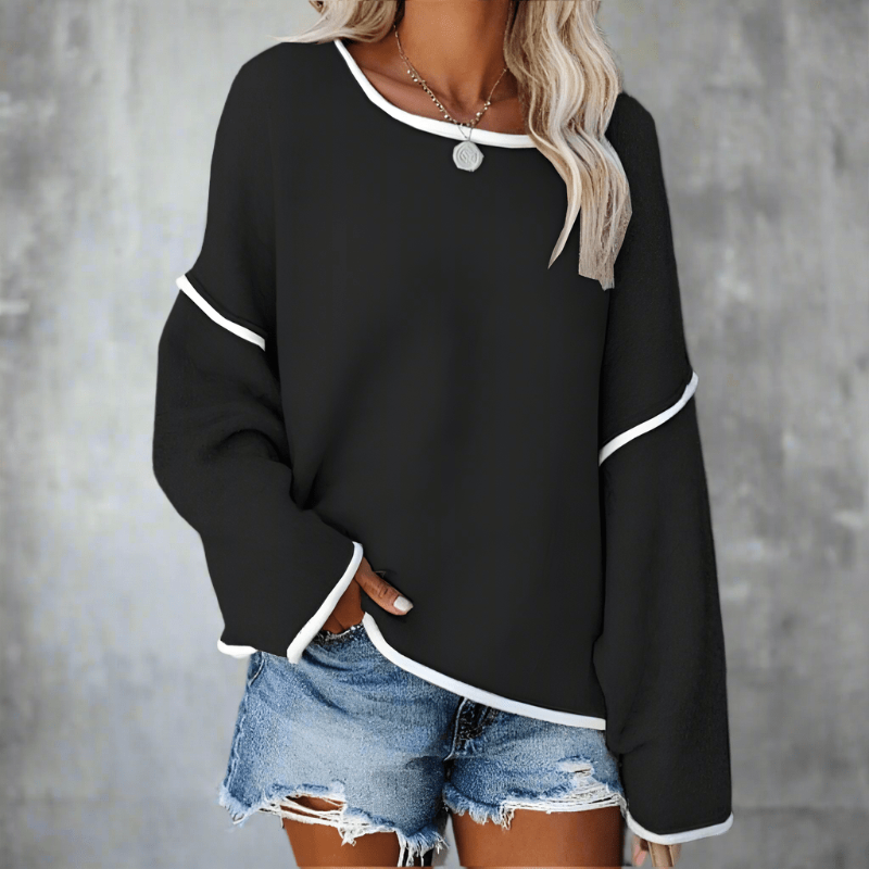 Oversized off-shoulder knit sweater in black with contrast trim and long sleeves