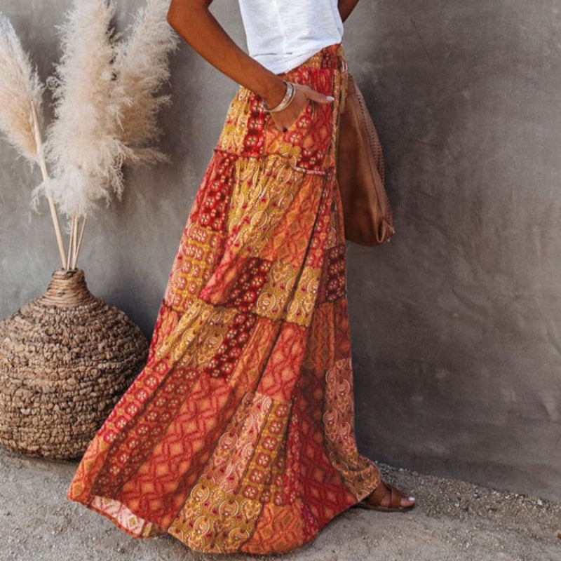 Tiered cotton maxi skirt with patchwork floral print, elastic waist, red-orange