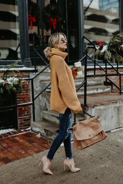 Camel knit high-neck sweater with long sleeves and ribbed hem.