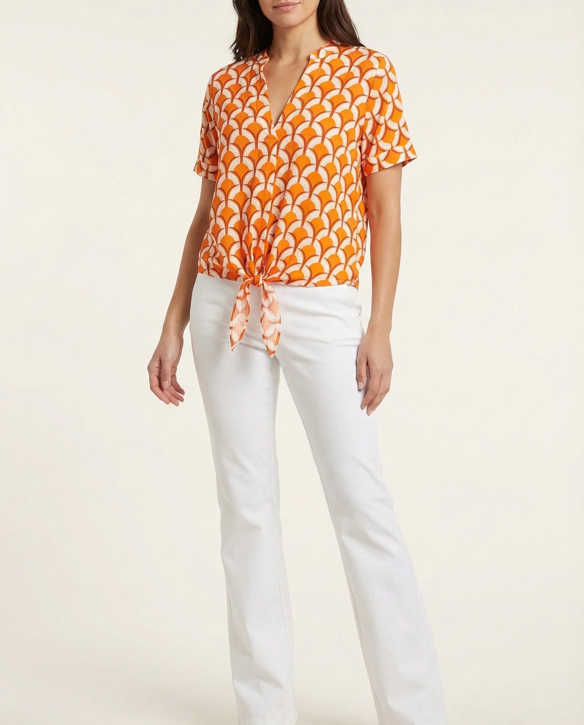 V-neck tie-front blouse with short sleeves, orange and white geometric print