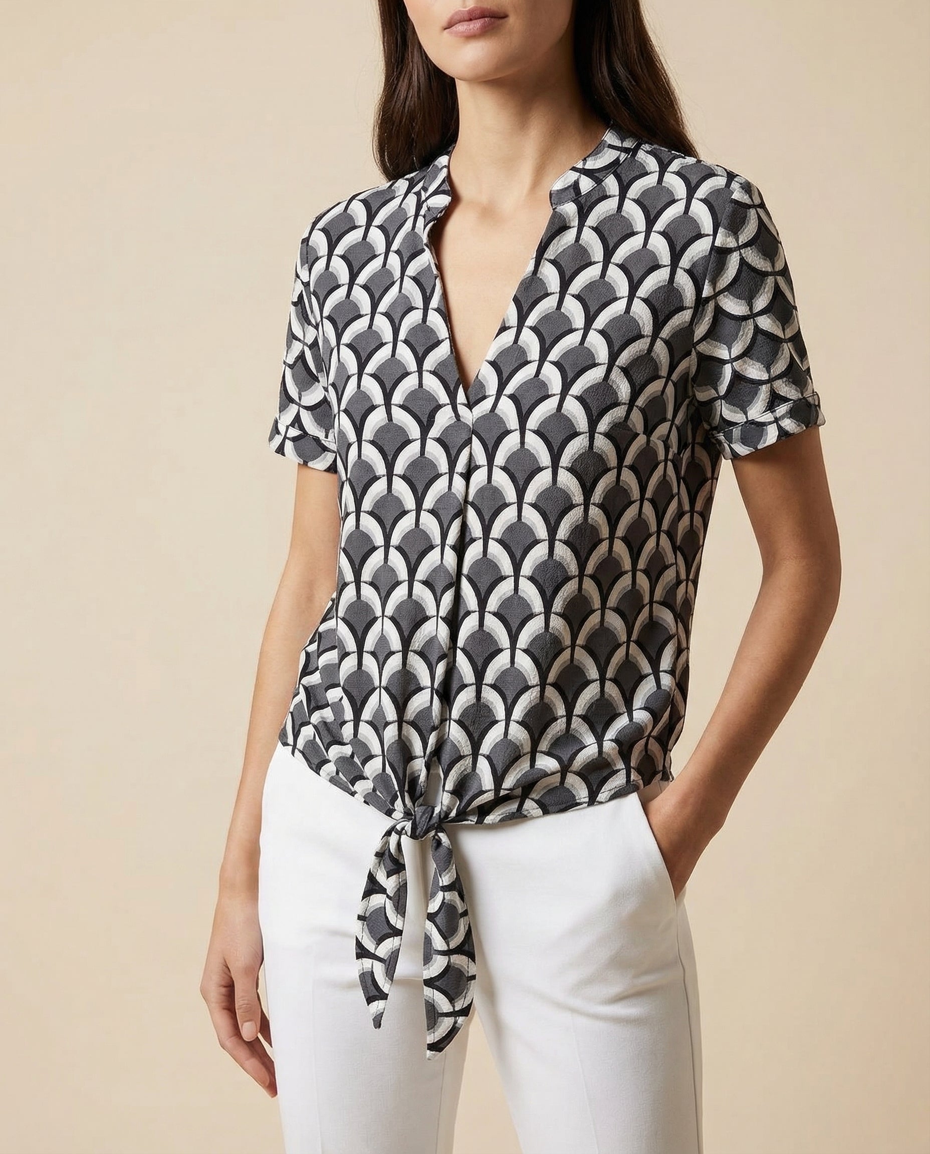 V-neck tie-front blouse with short sleeves, black and white fan geometric print