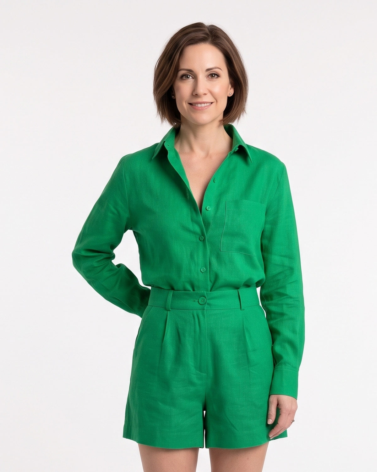Green linen two-piece set with button-up shirt and belted shorts