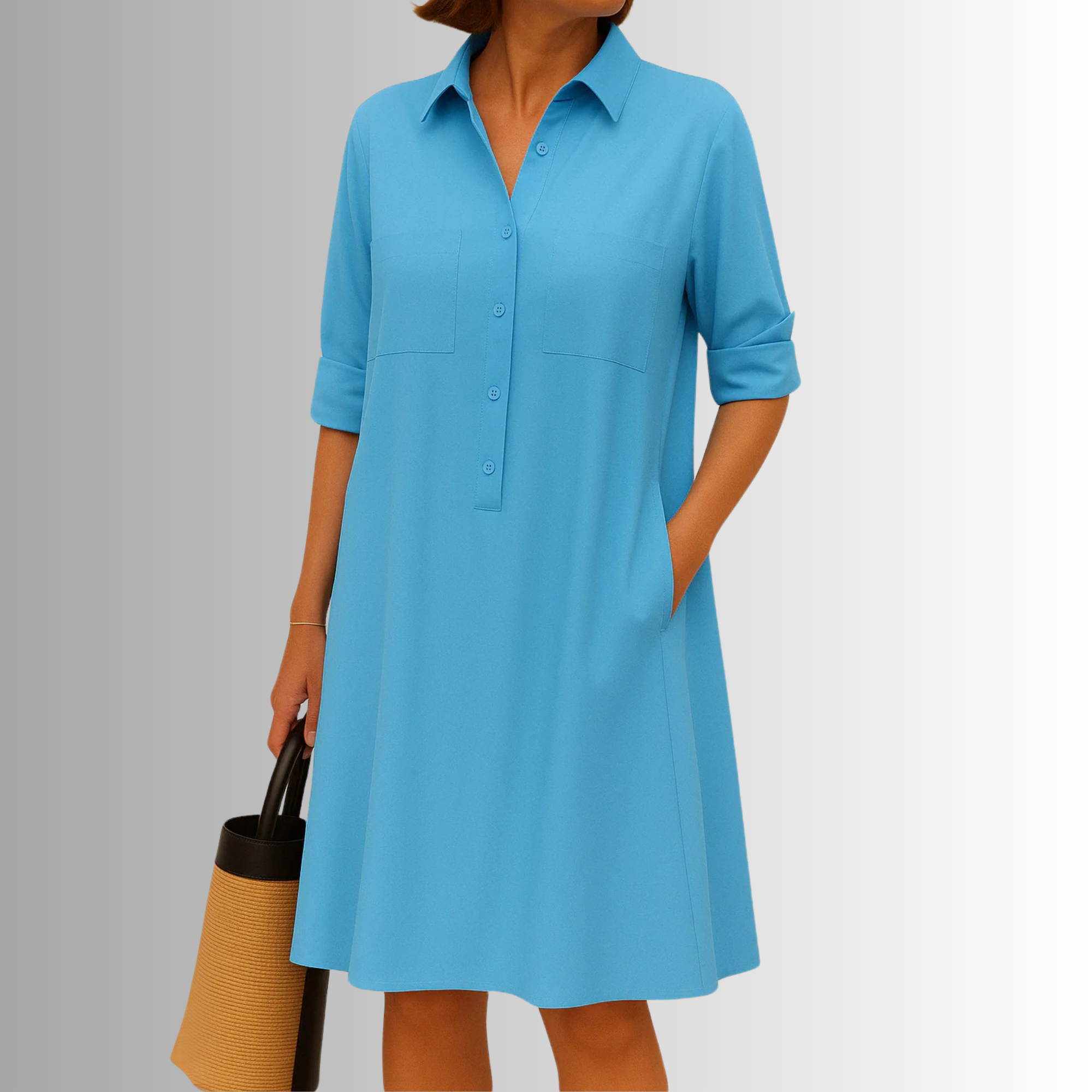 Blue button-down A-line dress with collar, front buttons, and chest pockets.