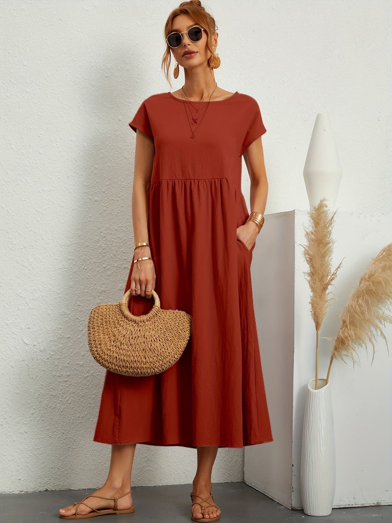Rust orange maxi dress with gathered smocked bodice and short sleeves, loose A-line