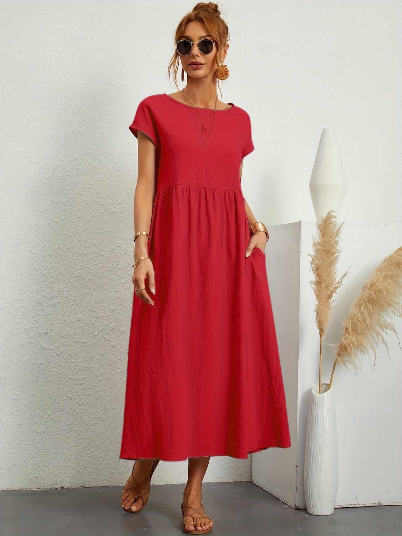 Red maxi dress with gathered smocked bodice and short sleeves, loose A-line